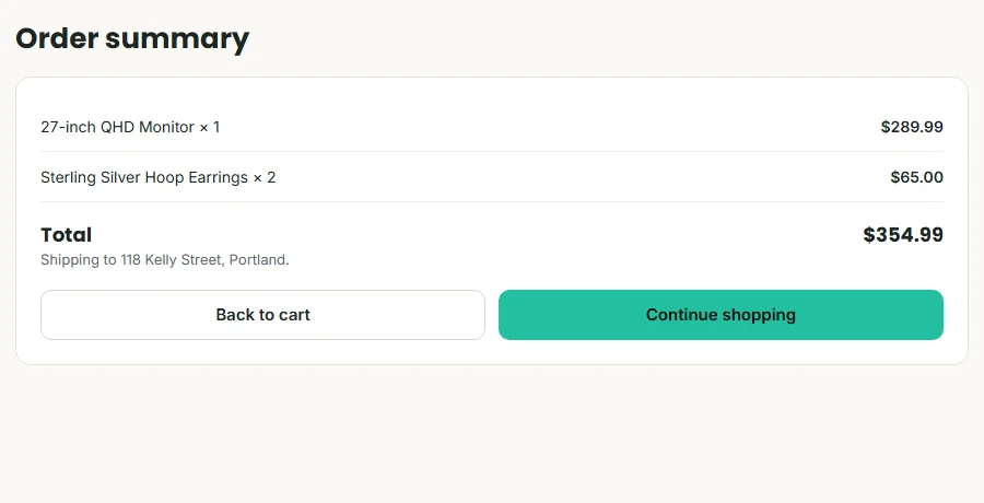 Order summary listing the monitor, the total and the shipping address, with Back to cart and Continue shopping buttons