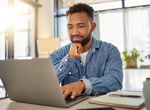 User testing the prototype on a laptop